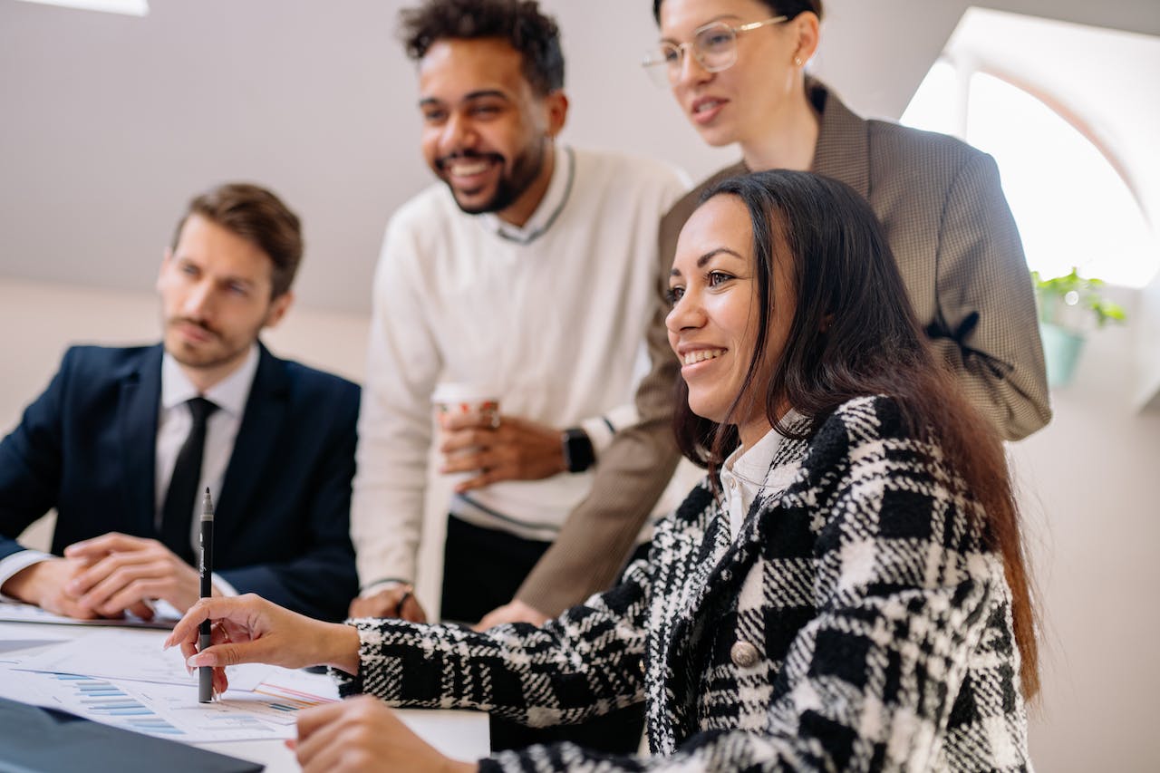 4 people at an office working together