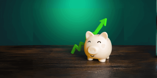 a piggy bank with a green arrow pointing upwards