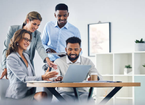 team working around a computer